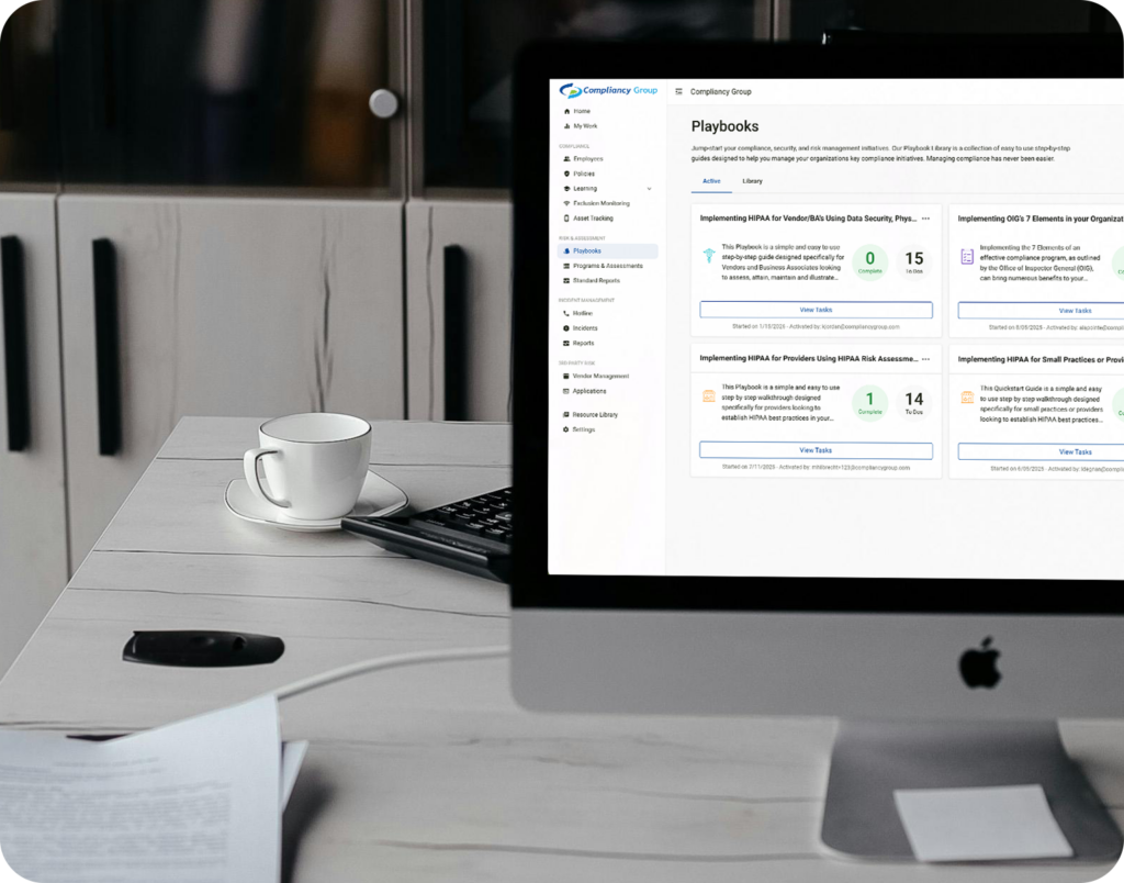 healthcare compliance dashboard on macbook on desk