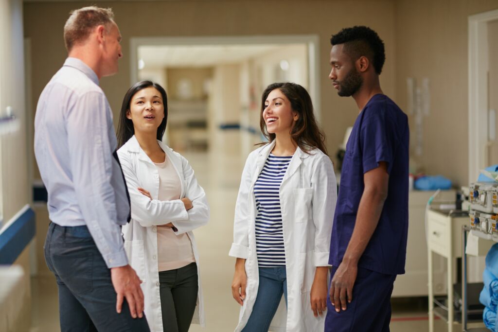 Team discussing AI in the industry | Healthcare compliance trends