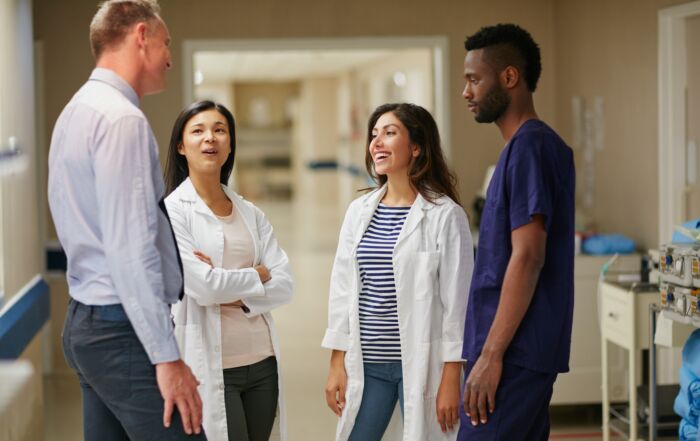 Team discussing AI in the industry | Healthcare compliance trends