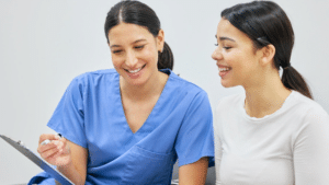 Dentist reviewing compliance with a new staff member | Dental compliance