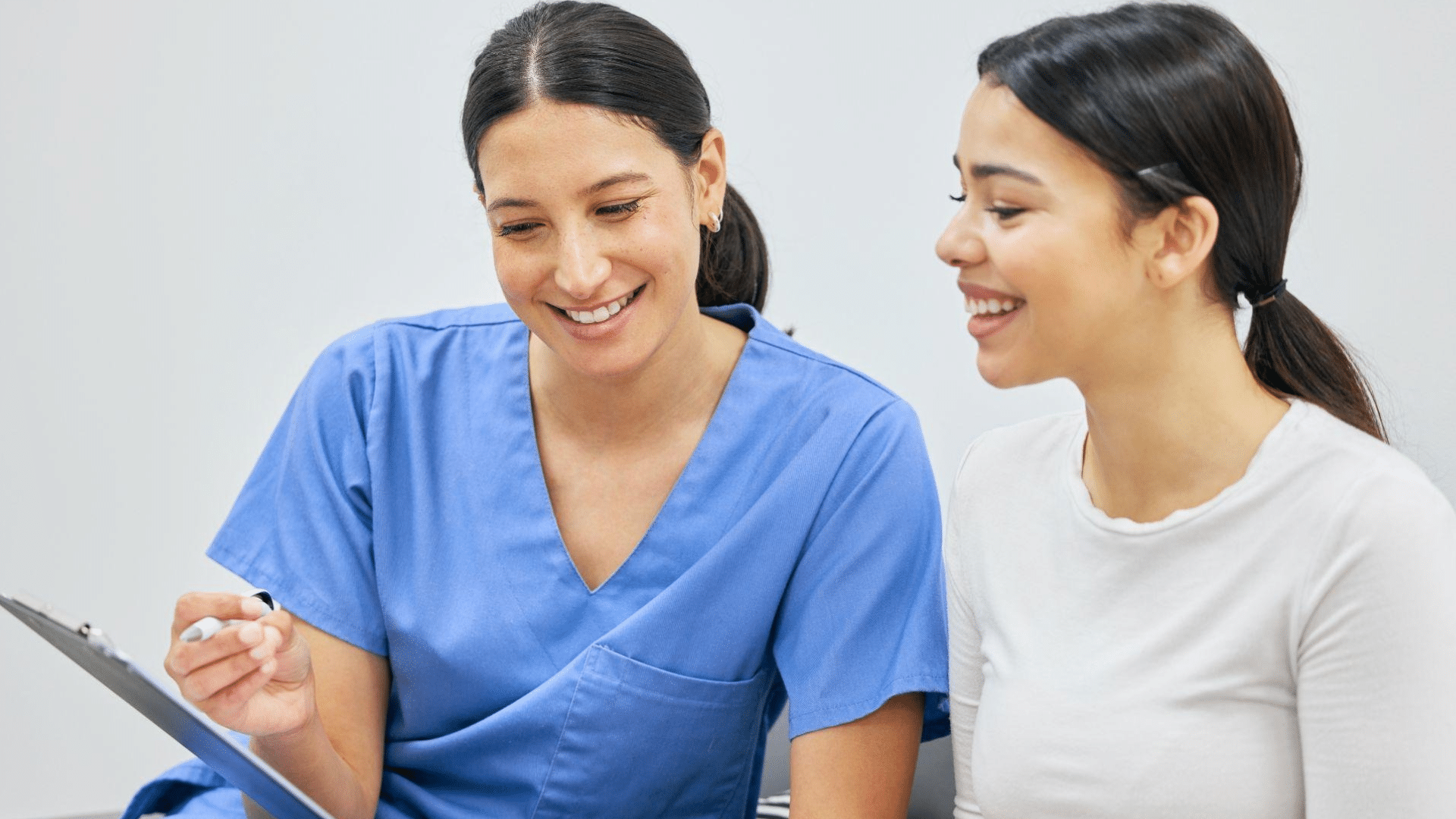 Dentist reviewing compliance with a new staff member | Dental compliance