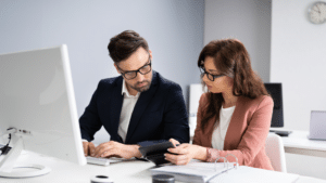 Compliance officer reviewing audit documentation on a laptop | healthcare compliance audit