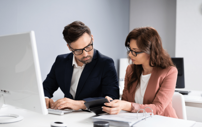 Compliance officer reviewing audit documentation on a laptop | healthcare compliance audit