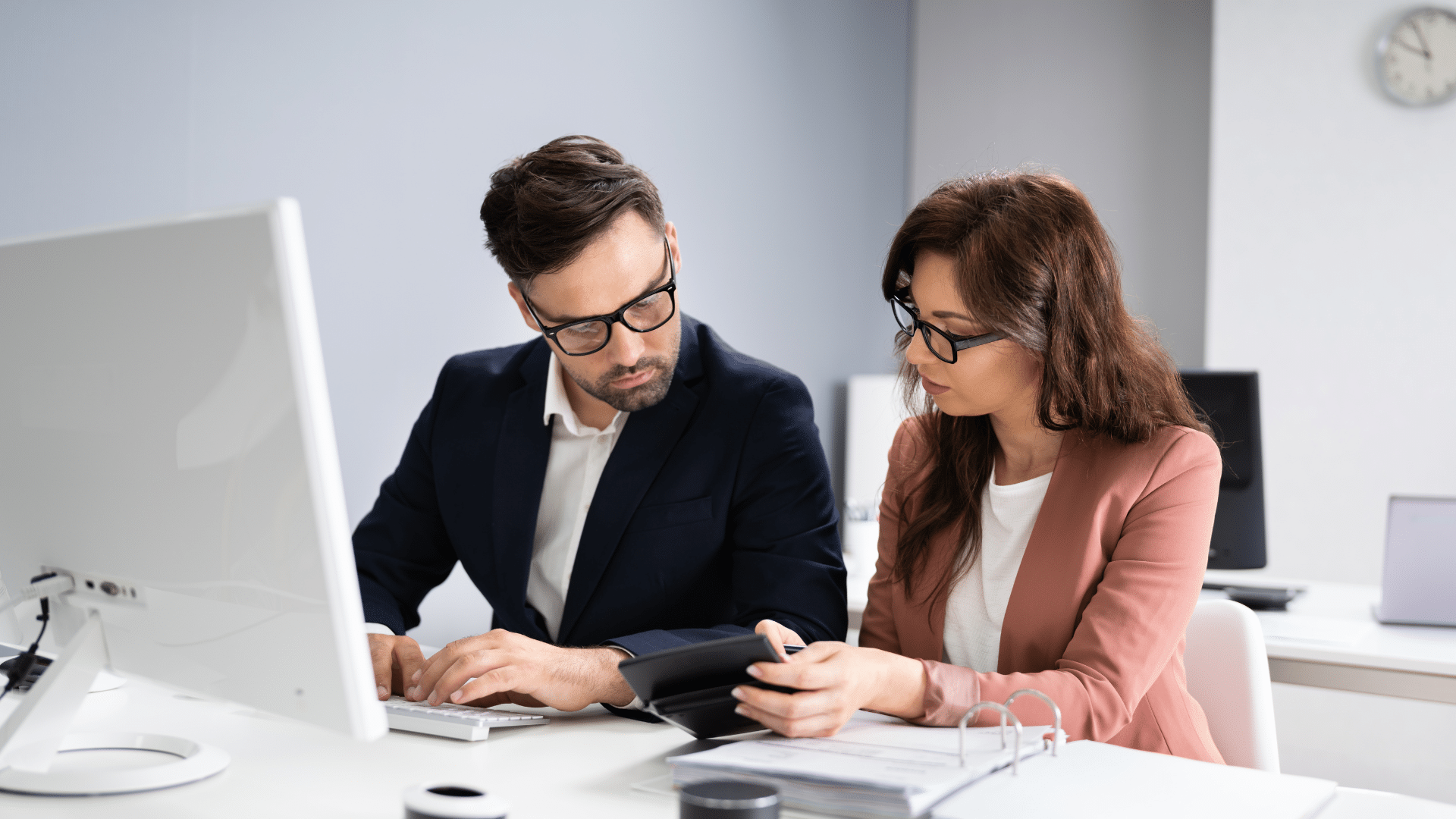 Compliance officer reviewing audit documentation on a laptop | healthcare compliance audit