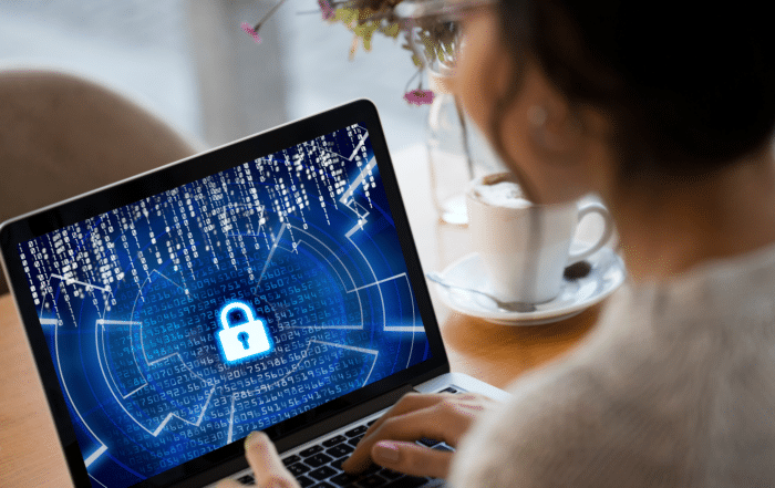 Compliance officer reviewing a HIPAA security checklist for Cybersecurity Awareness Month in healthcare